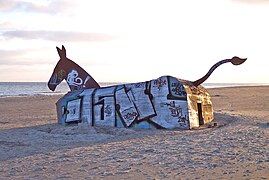 Beach bunker with improvised art in Blåvand, Denmark