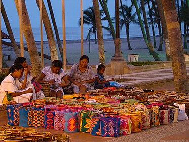 Wayuu, or Guajira, women of the Guajira peninsula in Venezuela and Colombia, making and selling bags