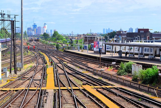 The complex mass of train tracks through Clapham Junction, UK as an analogy of the complex society its infrastructure supports.