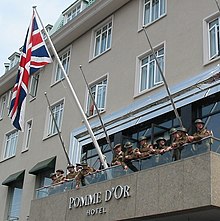 Re-enactment of the raising of the Union Jack during the Liberation of Jersey (9 May) Flag raising reenactment Pomme d'Or Liberation Day 2008 Jersey 4.jpg