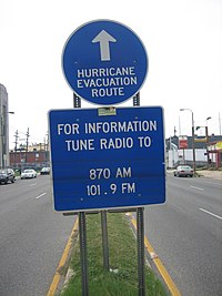 Evacuation route sign on Tulane Avenue in New Orleans shows lines from long standing floodwaters after Hurricane Katrina Hurricane Route sign Tulane Avenue floodlines.jpg