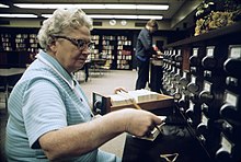 Librarian at the card files at a senior high school in New Ulm, Minnesota (1974) Librarian at the card files at a senior high school in New Ulm, Minnesota.jpg