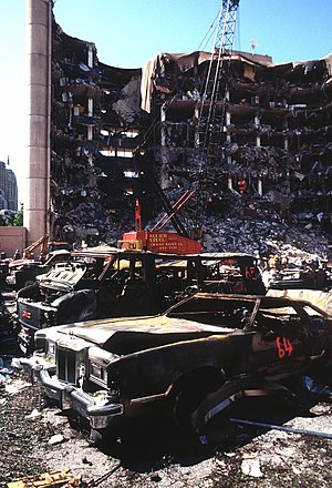 The bombed remains of automobiles with the bom...