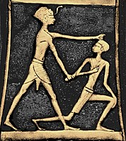 Pharaoh Ahmose I slaying a Hyksos (axe of Ahmose I, from the Treasure of Queen Aahhotep II) Colorized per source.jpg