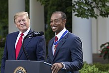 Woods receiving the Presidential Medal of Freedom from President Donald Trump in May 2019 President Trump Presents the Medal of Freedom to Tiger Woods (47796274401).jpg