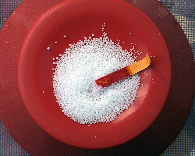 Sodium bisulfate, as a white powder, turns indicator paper red.