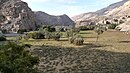 The ravines of Wadi Jib, located to the east and northeast, form a large bend known to some tourists as the Hidden Oasis