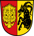 Gemeinde Heroldsbach Gespalten von Rot und Gold; vorne ein herschauender goldener Löwenkopf mit einer goldenen heraldischen Lilie im Maul; hinten ein schwarzer Steinbockrumpf.