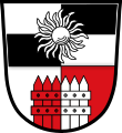 Gemeinde Ehingen Geteilt; oben geviert von Silber und Schwarz, belegt mit einer silbernen Silberdistelblüte; unten gespalten von Silber und Rot mit einem wachsenden Palisanderzaun in verwechselten Farben.
