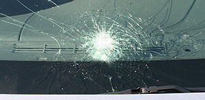 Automobile windshield displaying "spiderw...