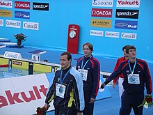 Victory lap of the 100 m butterfly during the 2005 FINA World Championships in Montreal. Phelps is far right. 2005 FINA World Championships - victory lap of the 100 m butterfly.jpg
