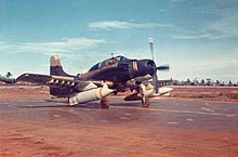 A BLU-72/B bomb on a USAF A-1E taking off from Nakhon Phanom in Thailand, in September 1968 A-1E 1SOS PavePat 1968.jpg