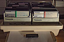 The USB stick under the two boxes of about 80 floppy disks is capable of holding over 130 times as much data as the two boxes of disks put together. Box of floppy disks and USB memory stick.jpg