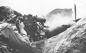 U.S. Marine Browning M1917 machine gun firing at the Japanese