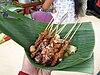 Chicken satay on banana leaf in Java.jpg