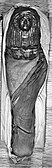 The mummy of Merit with cartonnage mask, wrapped in her outer shroud