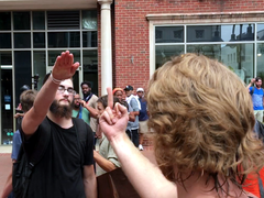 A participant at the Unite the Right rally gave a Nazi salute and was subsequently assaulted by counter-protesters.