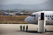 Russian Sukhoi Su-24 passes a Syrian Air Airbus A320 at Bassel Al-Assad International Airport in Latakia. Russian Air Force Sukhoi Su-24 passes a Syrianair Airbus A320 at Latakia.jpg