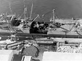 USS Lakehurst (formerly Seatrain New Jersey), after discharging medium tanks at Safi, Morocco. Load is damage plane to be repaired.