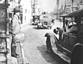 Image 35A Tokyo taxi driver indicating a fare of 50 Sen by holding up five fingers, in 1932 (from Transport in Greater Tokyo)