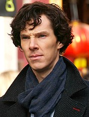 Benedict Cumberbatch facing left while in costume for filming Sherlock with black hair