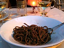 Bigoli in salsa (bigoli with anchovy sauce) at a restaurant in Venice, Italy