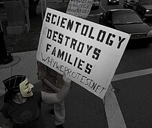 A protester criticizing Scientology Epic Energy Girl.jpg