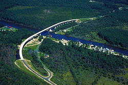 Aerial view of a stretch of the Intracoastal Waterway in Pamlico County, North Carolina, USA. The U.S. Army Corps of Engineers constructed the Hobucken Bridge over the waterway to replace an old swing-style drawbridge. The bridge carries NC state routes 33 and 304 over the waterway.