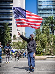 A protester waving an American flag