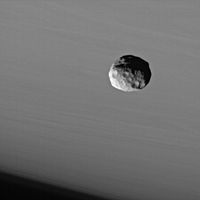 Janus in front of Saturn as imaged by Cassini (2006-09-25).