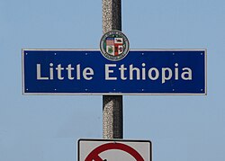 Little Ethiopia neighborhood sign located at the intersection of Fairfax Avenue and Olympic Boulevard