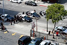 Los Angeles Police Department officers arresting suspects during a traffic stop Los Angeles Police Department Ford CVPIs on scene of felony traffic stop.jpg