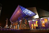 The Lowry is a combined theatre and exhibition centre at Salford Quays, and is Greater Manchester's most visited tourist attraction. Lowry Theatre at night.jpg
