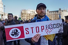 A poster against Ruscism in a pro-Ukraine protest in London's Trafalgar Square Russia + Fascism = Ruscism (51911310536).jpg