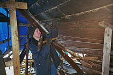 Caulking a wooden boat.