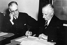 Governor-General the Lord Gowrie signs a declaration of war against Japan as John Curtin looks on, 1941. Aust-ww2-japan.jpg