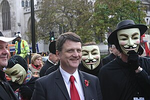 Gerard Batten MEP poses with protesters outsid...