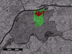 The town centre (red) and the statistical district (light green) of Beneden-Leeuwen in the municipality of West Maas en Waal.