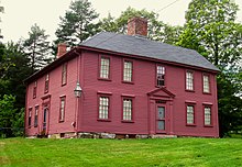 La taverne Munroe, bâtiment en bois peint en rouge foncé.