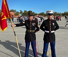 A new U.S. Marine stands with his drill instructor on graduation day. Parris Island Graduation.jpg