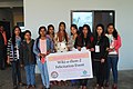 Participants (Girls) Holding Banner During 1st Anniversary Of MWUG & Felicitation Program