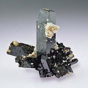 Greenish-black crystals of aegirine with whitish feldspar