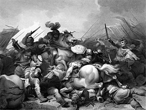 Battle scene with many figures. A knight astride a charger and wielding a lance unhorses another knight. Two unhorsed knights battle. Infantry advances from the right, led by a man with raised sword. Bodies litter the ground.