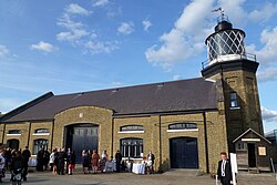 Bow Creek Lighthouse, a warehouse and a shed exhibiting Michael Faraday's work.