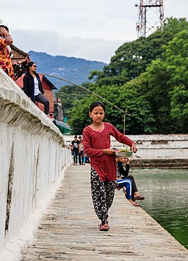 Girl selling Cucumber