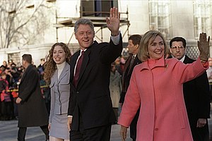 US President Bill Clinton (center with hand up...