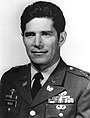 A head and shoulders portrait of a cleanshaven man with dark hair, wearing a military uniform.