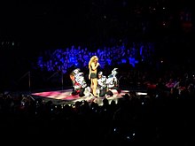 Carey and her dancers performing the lead single "Fantasy" on The Adventures of Mimi tour in 2006. Mariah Carey Fantasy Mimi Tour.jpg