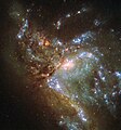 Галактиката NGC 6052, сливаща се в единна структура.