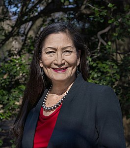 Deb Haaland is from the Laguna Pueblo people and is the first Native American Cabinet Secretary as Secretary of Interior. Her father is Norwegian-American.[58]